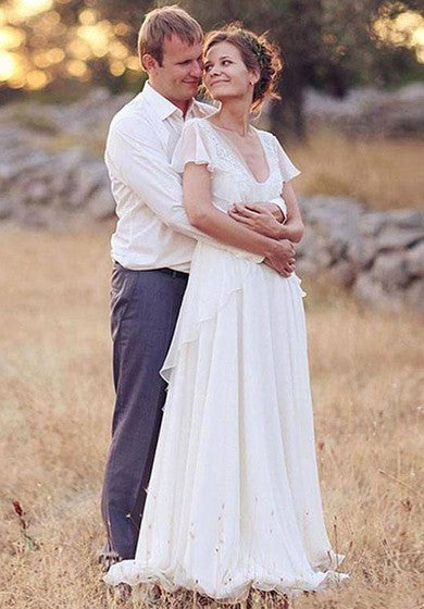 Robe de mariée en mousseline de soie plissée à manches transparentes et col en V profond et dos nu avec perles et fleurs