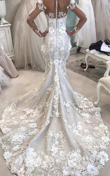 Robe de mariée sirène à manches longues et décolleté en cœur avec appliques