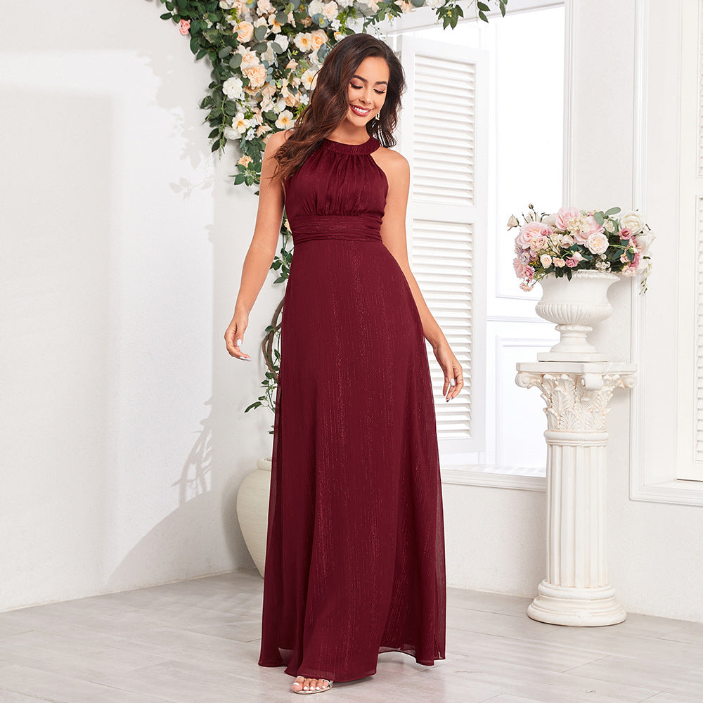 Elegantní maxi formální/večerní šaty s halter výstřihem, průstřihem na zádech, plisovaným živůtkem a áčkovou sukní