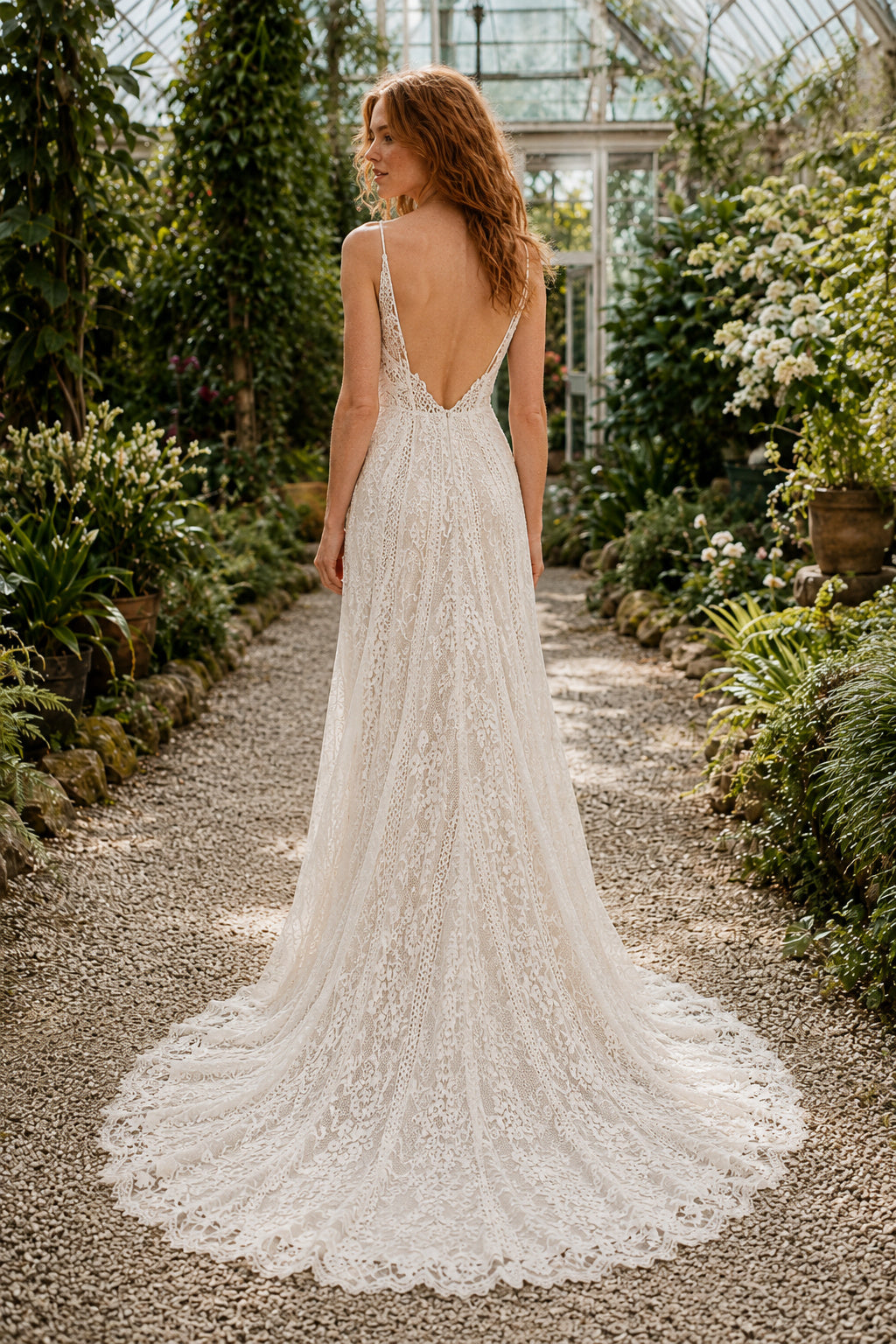 Ivory Spaghetti Strap Lace A-Line Wedding Dress with Deep V-Neck and Train back view