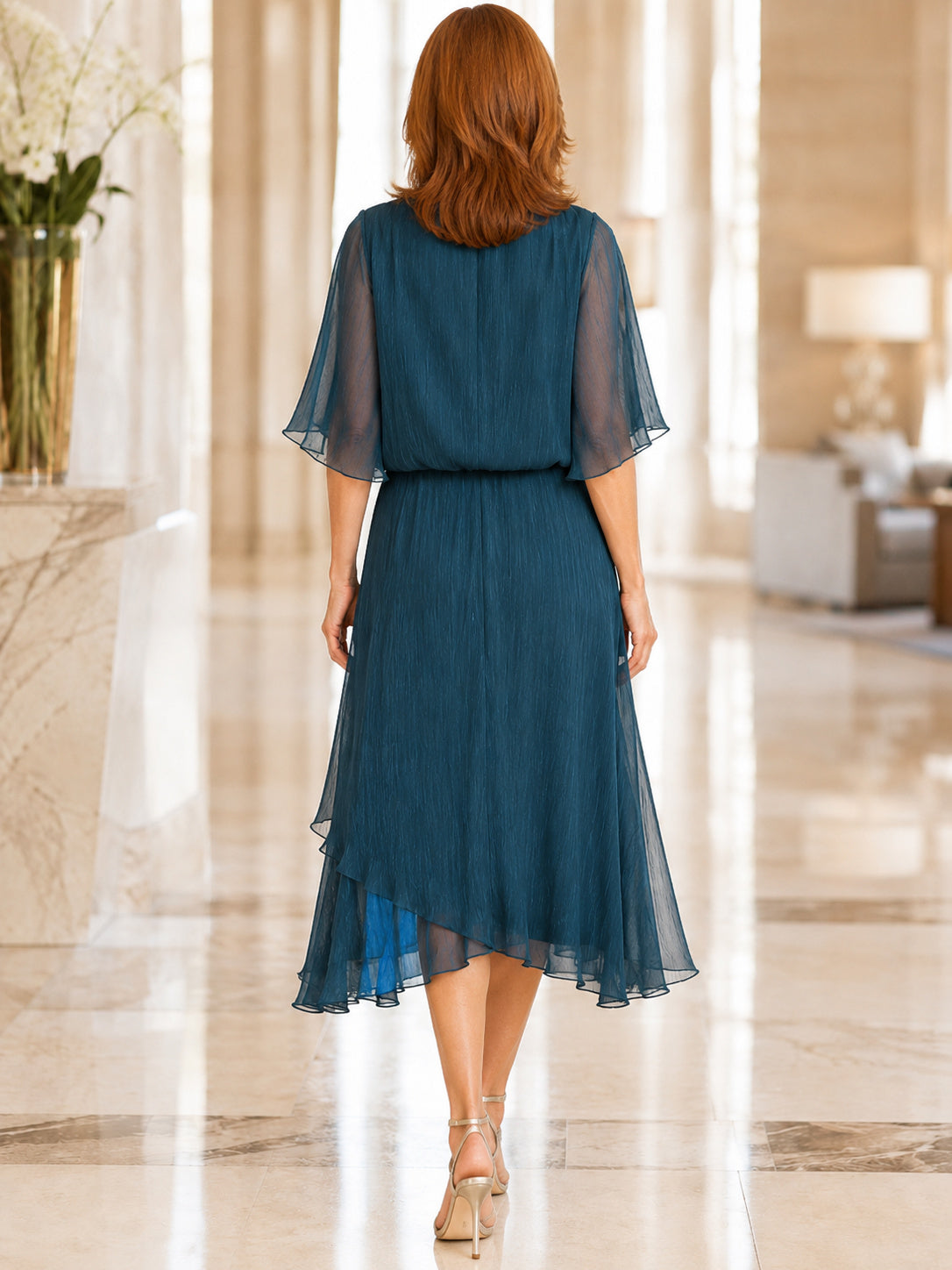 Teal chiffon cape sleeve knee length A-line dress back view
