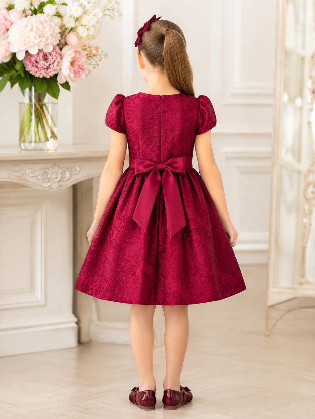 Burgundy Satin A-Line Flower Girl Dress with Cap Short Sleeve, jewel Neckline, and Knee length Skirt with Bow Accents back vi