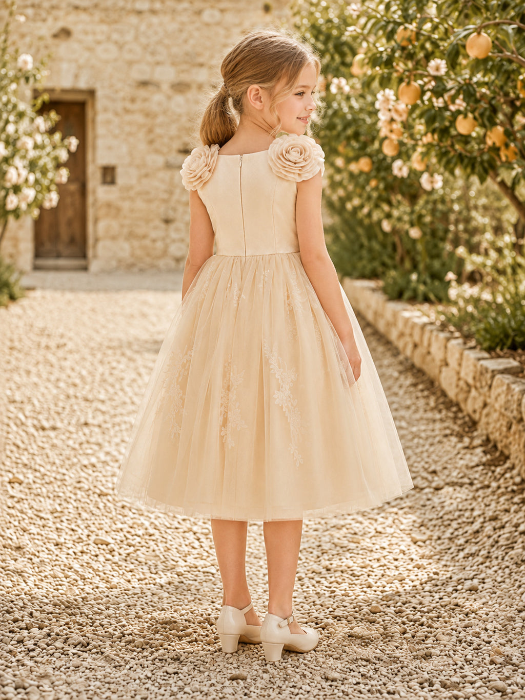 Champagne Rosette Shoulder Flower Girl Dress with Sleeveless Tulle A-Line, Floral Accents, Natural Waist, and Tea-Length Skir