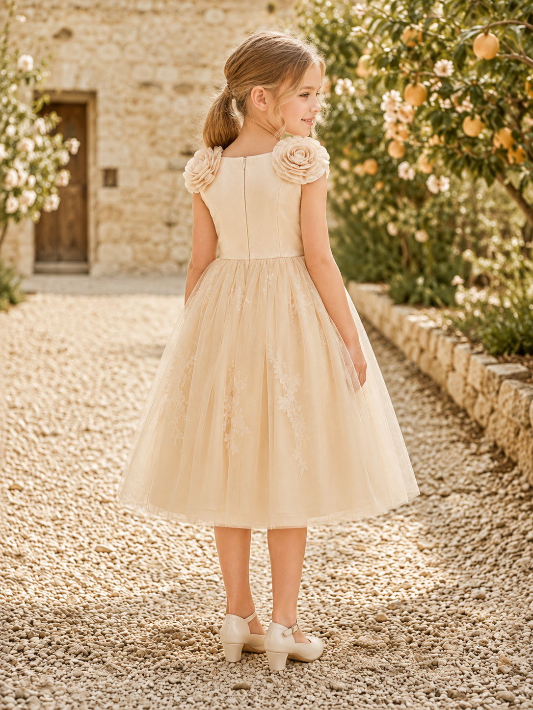 Champagne Rosette Shoulder Flower Girl Dress with Sleeveless Tulle A-Line, Floral Accents, Natural Waist, and Tea-Length Skir