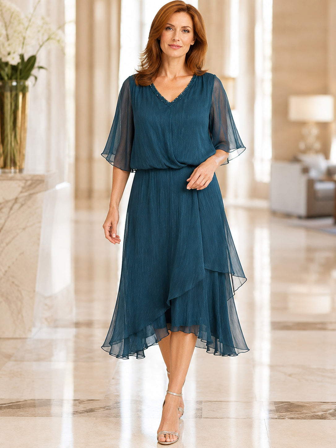 Teal chiffon cape sleeve knee length A-line dress front view