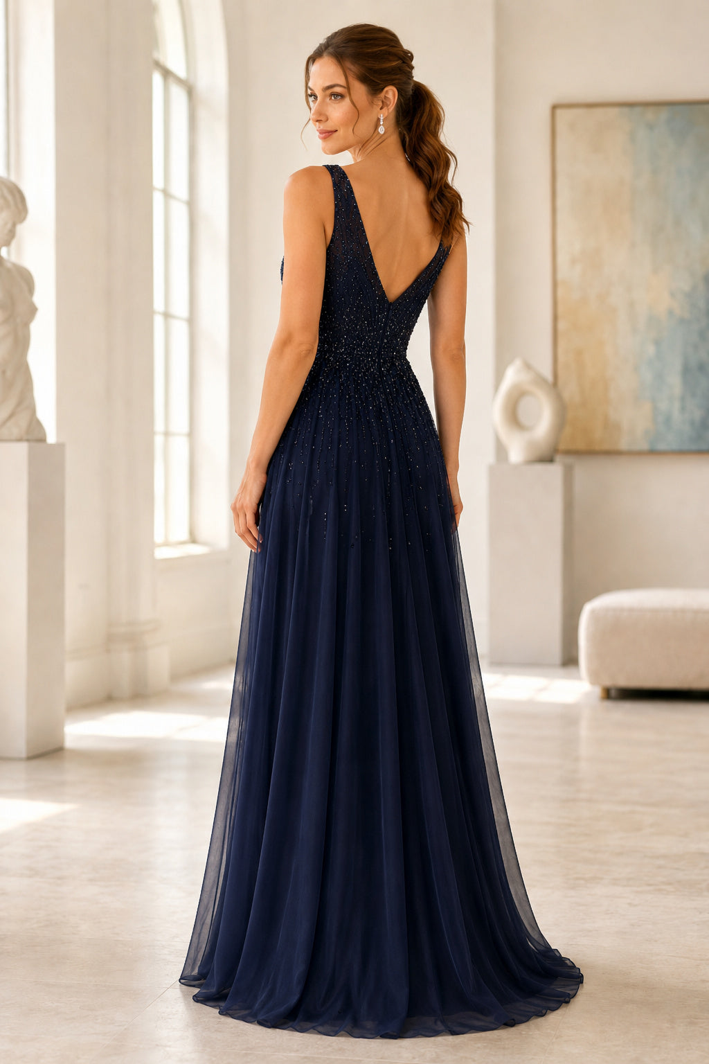 Dark Navy V neck sleeveless chiffon A line gown with pleated bodice and low V back Floor-length A-Line Prom Dress back view