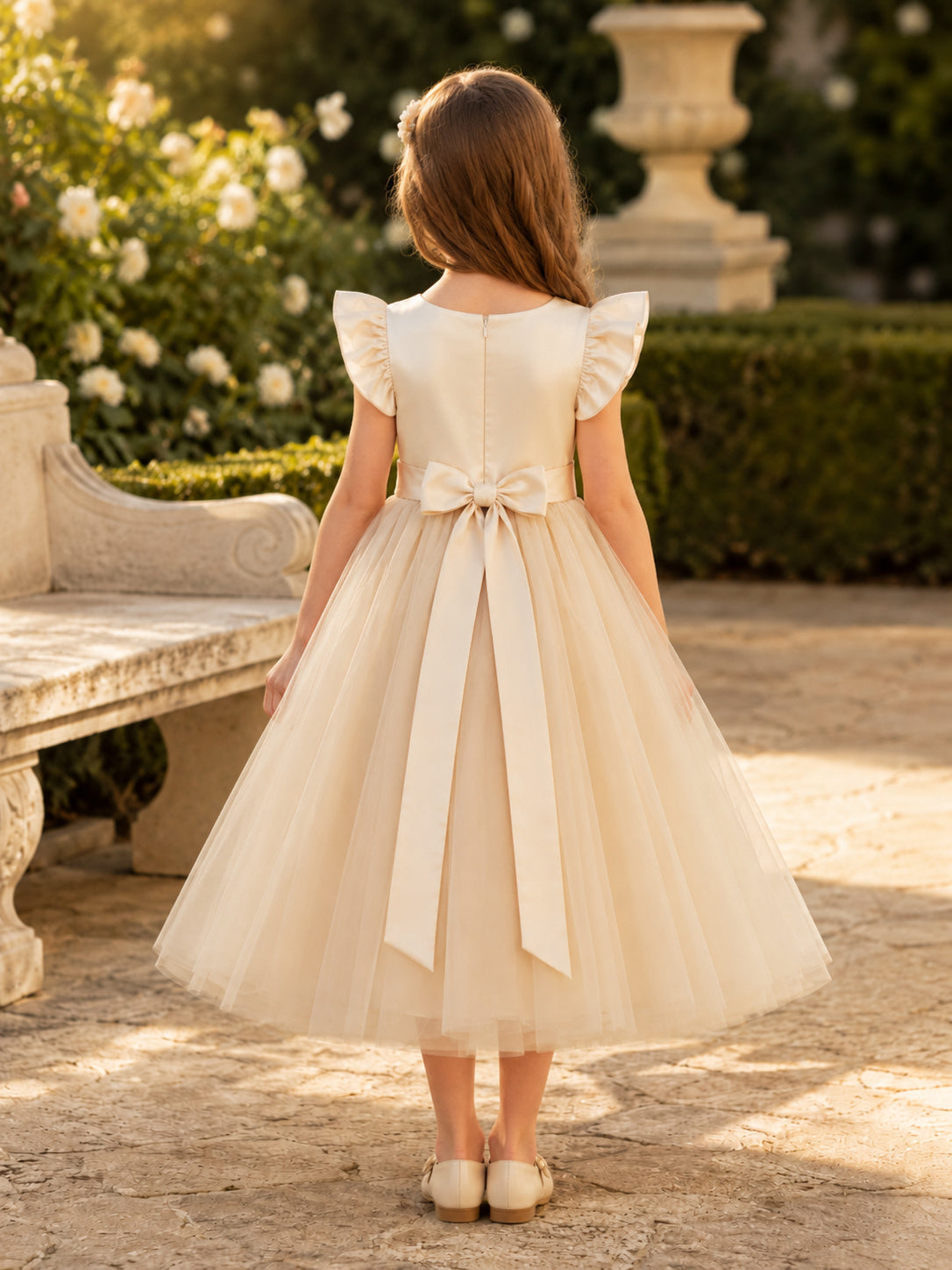 Champagne Cap Sleeve Tulle A-Line Flower Girl Dress with jewel Neckline and Tea length Skirt with Bow Detail back view