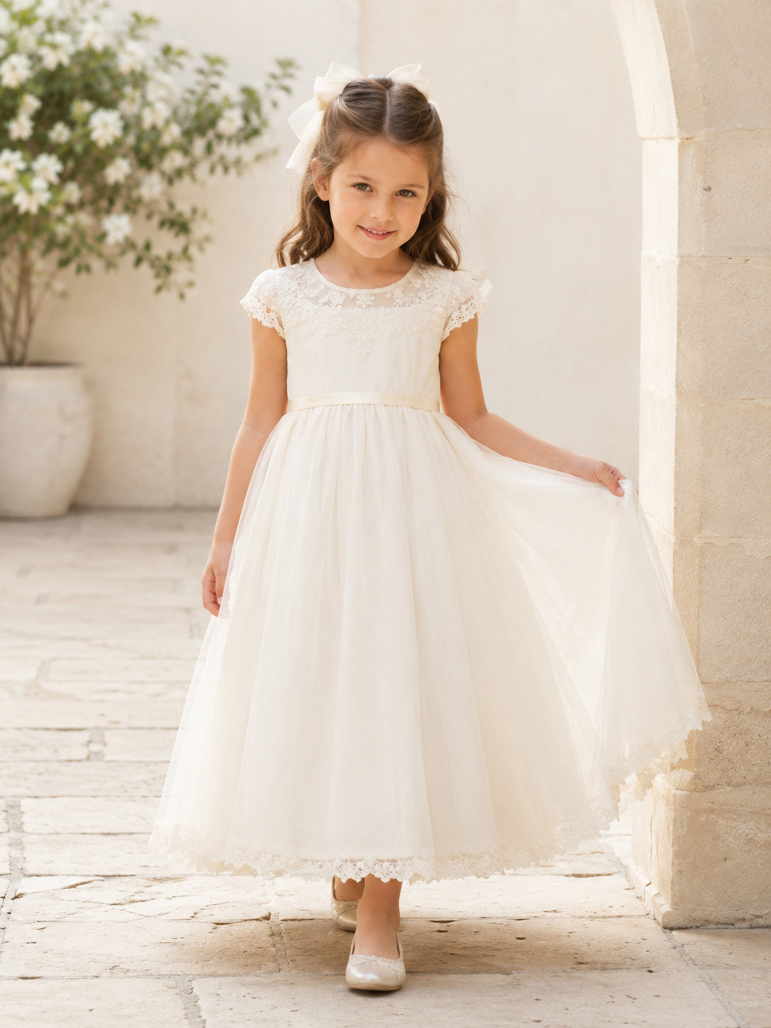 White Tulle A-Line Flower Girl Dress with Cap Short Sleeve, jewel Neckline, and Tea length Skirt with Soft Pleating front vie