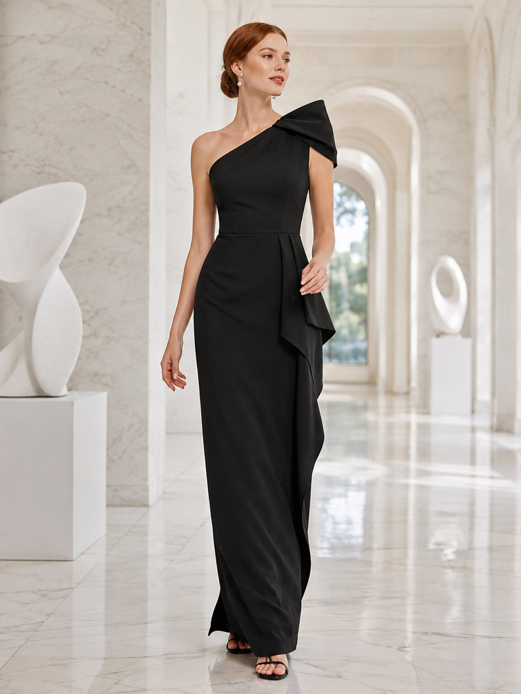 Black one shoulder sculptural bow sheath museum gala gown front view