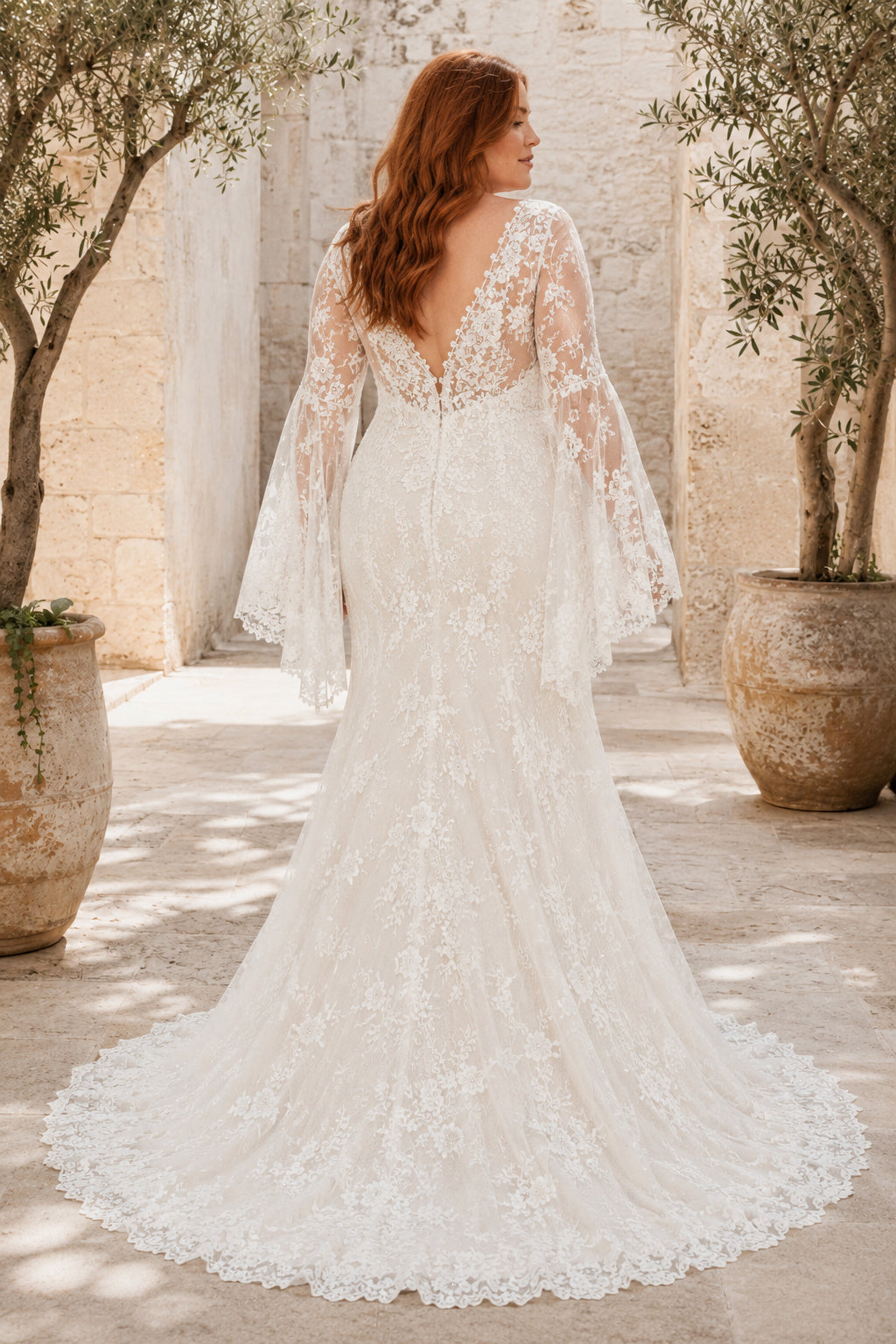 Plus Size Ivory V-Neck Bell Sleeve Lace Tulle Mermaid Wedding Dress with Bell Sleeves and Lace Mermaid Train back view