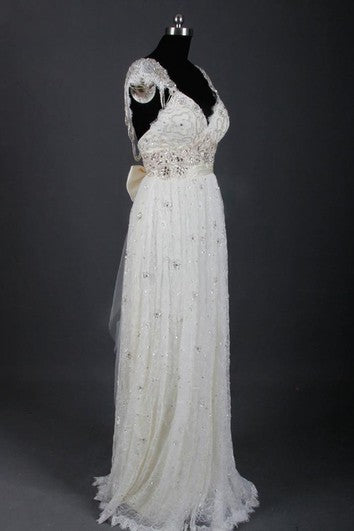 Šaty bez rukávů s kapkovým střihem a korálkováním