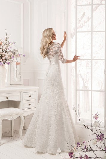 Robe fourreau longue en dentelle à manches longues et nœud