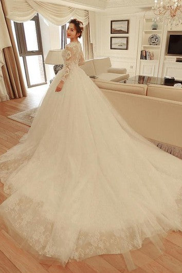 Elegant Lace and Tulle Scalloped Long Sleeved Ball Gown Wedding Dress