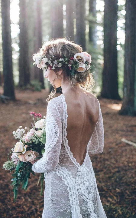 Abito da sposa a manica a maniche lunghe in pizzo bateau.